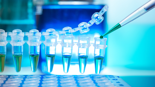 PCR test tubes in a diagnostics lab with a pipette dispensing liquid, illustrating venture capital fundraising needs for Diagnostics startups